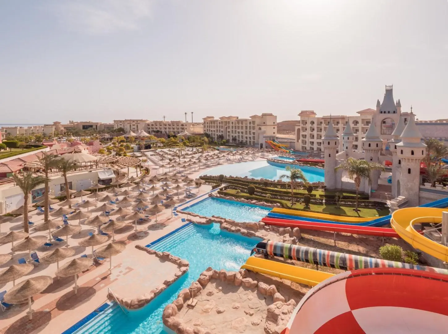 Аквапарк с цветни пързалки и шезлонги, поглед отгоре – Serenity Alma Resort (ex. Serenity Fun City Resort), Макади Бей