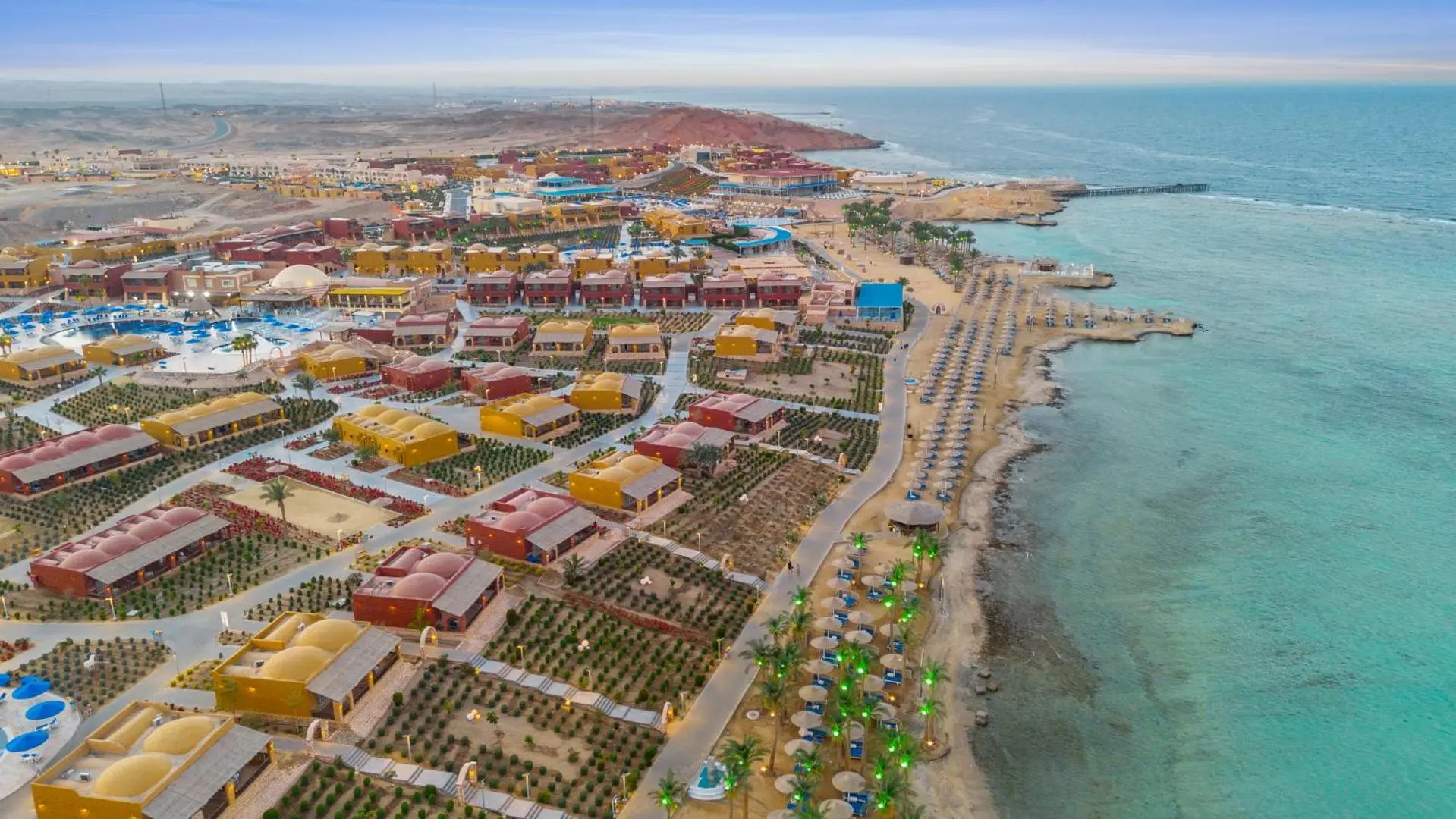 Цветни двуетажни сгради по брега, изглед от въздуха – Pickalbatros Villaggio Resort - Portofino Marsa Alam, Марса Алам