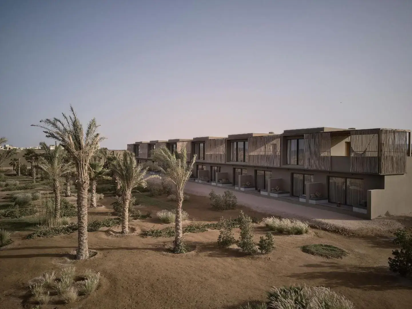 Нискоетажни сгради сред палми и пустинна градина по здрач – Casa Cook El Gouna (16+), Ел Гуна
