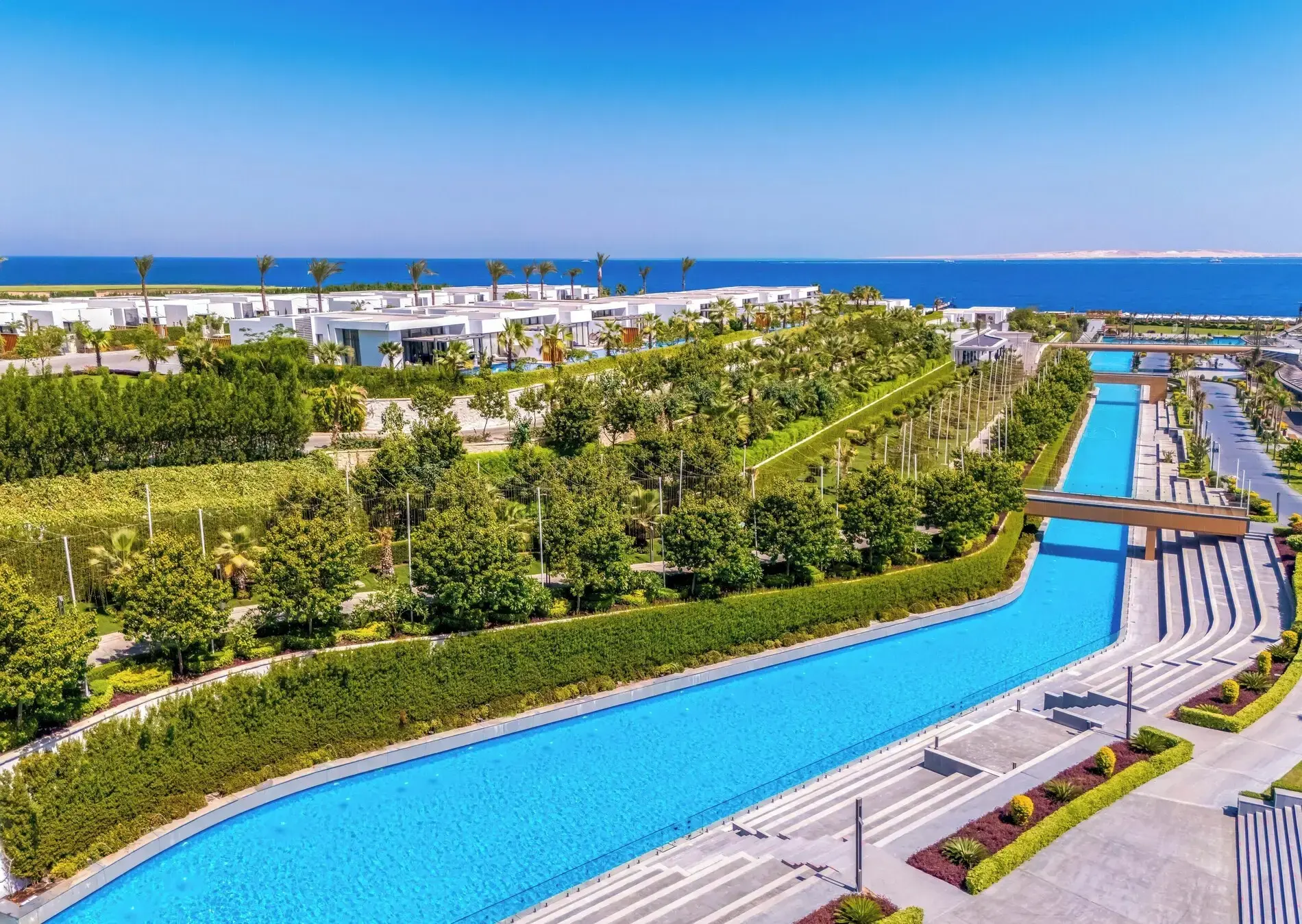 Изглед отвисоко към дълъг басейн сред градините към морето – Club Prive by Rixos Sharm El Sheikh, Шарм Ел Шейх