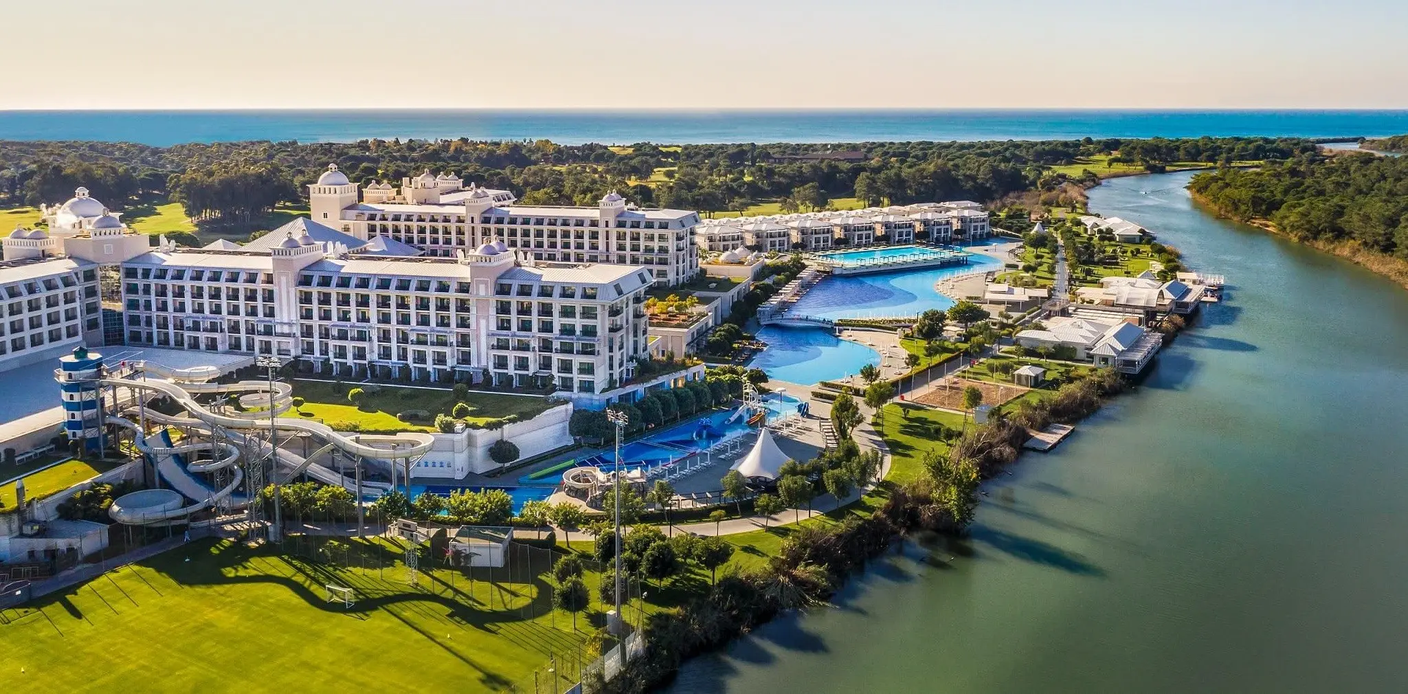 Въздушен изглед към комплекса, басейните и реката – Titanic Deluxe Golf Belek, Белек